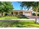 Charming single-story home with a well-manicured lawn and inviting front porch with white columns at 2879 E Austin Dr, Gilbert, AZ 85296