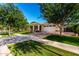 Attractive single-story home with a lush green lawn and a spacious brick-paved driveway at 2879 E Austin Dr, Gilbert, AZ 85296