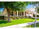 Inviting single-story home with a manicured lawn, inviting porch, and a charming tree at 2879 E Austin Dr, Gilbert, AZ 85296