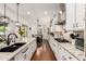 Bright kitchen featuring a large island and stainless steel appliances that opens to the dining area at 2879 E Austin Dr, Gilbert, AZ 85296
