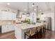 Bright kitchen featuring granite countertops, stainless steel appliances, and a spacious island with seating at 2879 E Austin Dr, Gilbert, AZ 85296