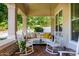 Inviting front porch with a swing and rocking chairs, perfect for relaxing outdoors at 2879 E Austin Dr, Gilbert, AZ 85296