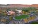 Aerial view of the beautiful clubhouse with expansive lawn and lush desert landscaping at 31207 N 124Th Dr, Peoria, AZ 85383