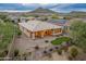 A covered patio and artificial turf create a low-maintenance backyard retreat at 31207 N 124Th Dr, Peoria, AZ 85383