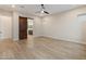 Bedroom with tile flooring and a rustic barn door leading to the bathroom at 31207 N 124Th Dr, Peoria, AZ 85383