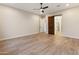 Bedroom featuring tile floors, barn door, and access to the bathroom at 31207 N 124Th Dr, Peoria, AZ 85383