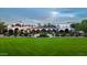 Beautiful clubhouse featuring manicured landscaping, elegant architecture, and inviting outdoor spaces at 31207 N 124Th Dr, Peoria, AZ 85383