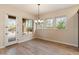 Dining area with bright windows and views of the outdoor desert landscape at 31207 N 124Th Dr, Peoria, AZ 85383