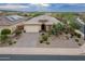 Charming single-story home with well-manicured desert landscaping and a neutral color palette at 31207 N 124Th Dr, Peoria, AZ 85383
