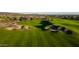 Beautifully maintained golf course with manicured greens, sand traps, and rolling hills at 31207 N 124Th Dr, Peoria, AZ 85383