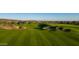 Expansive golf course featuring undulating fairways, sand traps, and desert landscaping, a golfer's paradise at 31207 N 124Th Dr, Peoria, AZ 85383