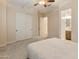 Main bedroom with walk in closet, ensuite bathroom, and plush carpeting at 31207 N 124Th Dr, Peoria, AZ 85383
