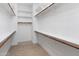 Bright, well-organized walk-in closet with shelving and rods for optimal storage at 31207 N 124Th Dr, Peoria, AZ 85383