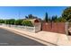 Charming ranch-style home with a privacy fence and mature landscaping at 3160 E Fox St, Mesa, AZ 85213