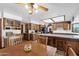 Open kitchen design with wood cabinets and stainless steel appliances at 3160 E Fox St, Mesa, AZ 85213