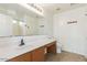 Bright bathroom features a large mirror and a vanity area with tile flooring at 3221 W Alta Vista Rd, Phoenix, AZ 85041