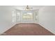 Bright bedroom featuring large windows and neutral carpet at 3221 W Alta Vista Rd, Phoenix, AZ 85041