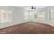 Bright bedroom featuring large windows and neutral carpet at 3221 W Alta Vista Rd, Phoenix, AZ 85041