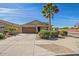 Charming single-story home featuring a well-maintained lawn and attached two-car garage at 3221 W Alta Vista Rd, Phoenix, AZ 85041