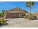 Charming single-story home featuring a well-maintained lawn and attached two-car garage at 3221 W Alta Vista Rd, Phoenix, AZ 85041