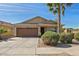 Charming single-story home featuring a well-maintained lawn and attached two-car garage at 3221 W Alta Vista Rd, Phoenix, AZ 85041