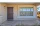 Charming front porch featuring a secure metal screen door and a neatly framed window at 3221 W Alta Vista Rd, Phoenix, AZ 85041