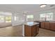 Bright kitchen featuring an island, tile floors, and stainless steel appliances at 3221 W Alta Vista Rd, Phoenix, AZ 85041