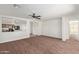 Spacious living room with neutral carpet and kitchen view at 3221 W Alta Vista Rd, Phoenix, AZ 85041