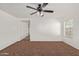 Living room with neutral carpet and ceiling fan at 3221 W Alta Vista Rd, Phoenix, AZ 85041