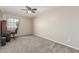 Bedroom with a work area and desk, complemented by neutral walls and carpet at 3424 E Harmony Ave, Mesa, AZ 85204