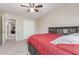 Bedroom featuring a bed with shelving headboard, adjacent to a closet at 3424 E Harmony Ave, Mesa, AZ 85204