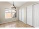 Bright dining room features a chandelier and large windows, with tile floors and white trim at 3424 E Harmony Ave, Mesa, AZ 85204