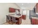 Spacious kitchen featuring an island with counter seating and a breakfast bar at 3424 E Harmony Ave, Mesa, AZ 85204