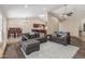 Living area featuring hardwood floors and two sofas with easy access to the kitchen at 3424 E Harmony Ave, Mesa, AZ 85204