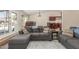 Comfortable seating area with hardwood flooring and access to a dining area at 3424 E Harmony Ave, Mesa, AZ 85204