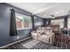 Movie room with tiered seating and dark walls, enhancing the viewing experience at 3424 E Harmony Ave, Mesa, AZ 85204