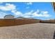 Expansive backyard with low-maintenance gravel landscaping and a sturdy brick wall for privacy at 3885 E Kenley Ln, San Tan Valley, AZ 85143