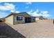 Expansive backyard featuring a covered patio, providing an ideal space for outdoor activities and relaxation at 3885 E Kenley Ln, San Tan Valley, AZ 85143