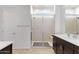 Modern bathroom with a glass shower, bench and a stylish vanity at 3885 E Kenley Ln, San Tan Valley, AZ 85143