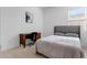 Cozy bedroom featuring a comfortable bed, desk and a bright window view at 3885 E Kenley Ln, San Tan Valley, AZ 85143