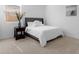 Bright, minimalist bedroom with a cozy bed and a decorative vase at 3885 E Kenley Ln, San Tan Valley, AZ 85143