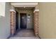 Inviting front entrance features a decorative wreath and stone pillar accents at 3885 E Kenley Ln, San Tan Valley, AZ 85143