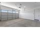 Spacious garage with ample storage space and a large door providing easy vehicle access at 3885 E Kenley Ln, San Tan Valley, AZ 85143
