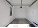 Clean, well-lit garage with a functional layout perfect for parking and additional storage at 3885 E Kenley Ln, San Tan Valley, AZ 85143
