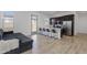 Open-concept kitchen boasts modern stainless-steel appliances, dark wood cabinets, and a bright white quartz breakfast bar at 3885 E Kenley Ln, San Tan Valley, AZ 85143