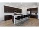 Spacious kitchen featuring a large island with bar stools, stainless steel appliances, and ample counter space at 3885 E Kenley Ln, San Tan Valley, AZ 85143