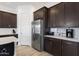 Well-equipped kitchen with stainless steel refrigerator, ample cabinetry, and a bright, functional design at 3885 E Kenley Ln, San Tan Valley, AZ 85143