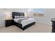 Calm main bedroom features a large bed, bedside tables with lamps, and bright, airy window light at 3885 E Kenley Ln, San Tan Valley, AZ 85143