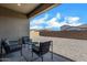 Inviting covered patio with comfortable seating, overlooking a spacious backyard at 3885 E Kenley Ln, San Tan Valley, AZ 85143