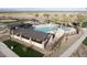 Aerial view of community pool with shade structures, palm trees, and play areas at 3885 E Kenley Ln, San Tan Valley, AZ 85143